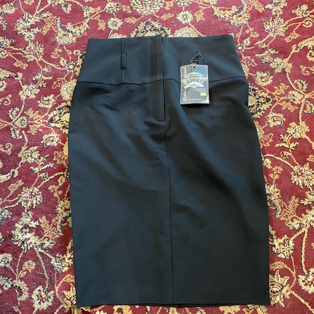 NWT Ladies Skirt with back slit. Color Black Size 6